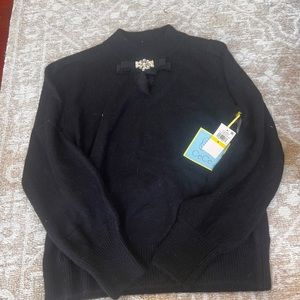Cece’s  black sweater with diamond